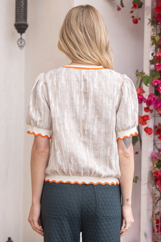 Neutral and Noticed Distressed Top